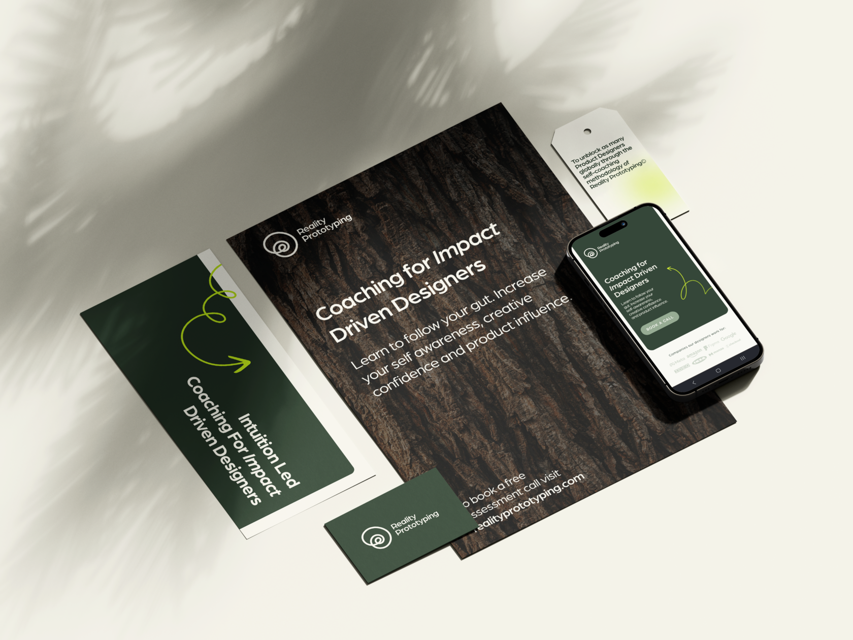 Brand Stationery mock up with a poster, card and a phone. Showcasing brand design for Reality Prototyping coaching and a mobile website design.